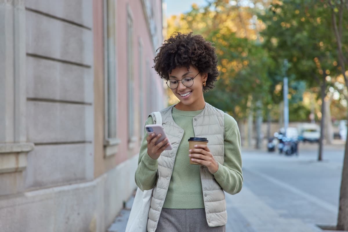 Woman checking personal loan offers on her phone